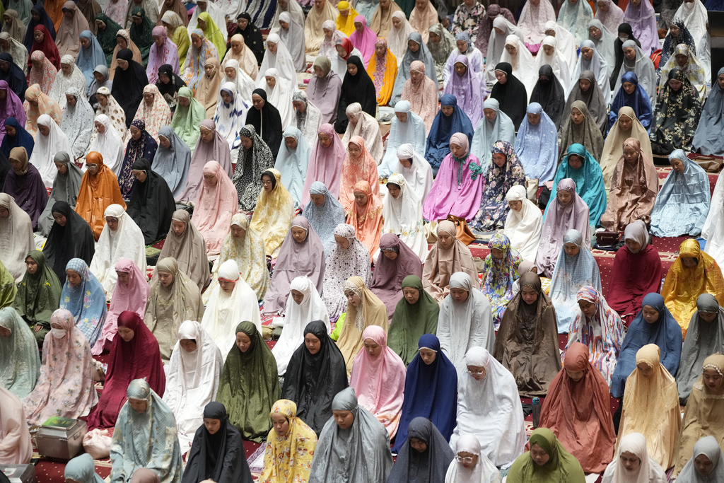 Indonesian Muslims perform an evening prayer called 'tarawih' marking the first eve of the holy fasting month of Ramadan, at Istiqlal Mosque in Jakarta, Indonesia, Wednesday, March 22, 2023. Millions of Muslims in Indonesia are gearing up to celebrate the holy month of Ramadan, which is expected to start on Thursday, with traditions and ceremonies across the world's most populous Muslim-majority country amid soaring food prices. (AP Photo/Achmad Ibrahim)