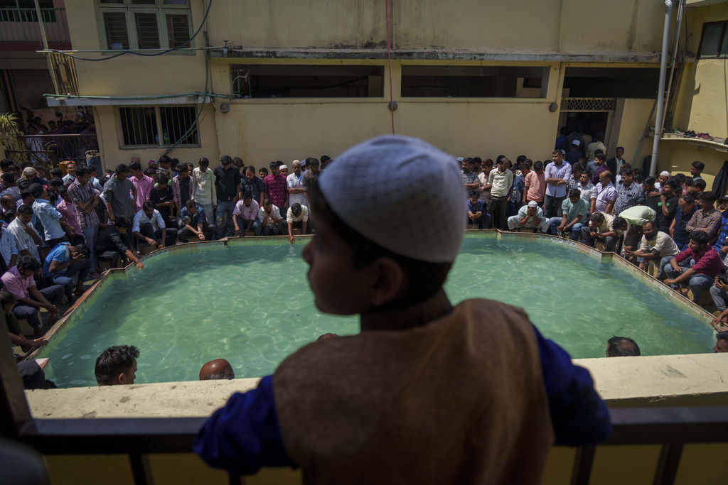 Nepalese Muslims perform ablution before prayer during the first day of Ramadan in Kathmandu, Nepal, Friday, March 24, 2023. Muslims throughout the world are marking the month of Ramadan, the holiest month in the Islamic calendar during which devotees fast from dawn till dusk. (AP Photo/Niranjan Shrestha)