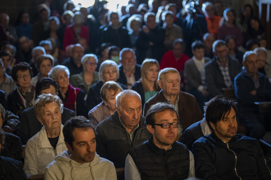 Worshippers attend a mass before taking part in a procession in the church of the Mare de Déu dels Torrents, in l'Espunyola, north of Barcelona, Spain, Sunday, March 26, 2023. Farmers and parishioners gathered Sunday at the small hermitage of l'Espunyola, a rural village in Catalonia, to attend a mass asking the local virgin Our Lady of the Torrents for rain. The eastern Spanish region is among the worst affected by the severe drought that hits the whole of the Mediterranean country. (AP Photo/Emilio Morenatti)