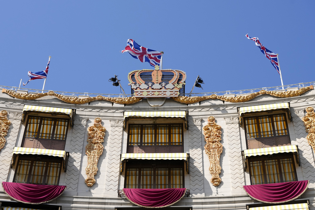 A facade mimicking the 1953 Coronation decor by Oliver Messel, decorates the Dorchester Hotel in London, Thursday, April 20, 2023. The Dorchester Hotel, long a favorite with royals and celebrities, concocted a lavish, five-tier coronation cake and put up theater-style draping across its facade to re-create the decorations that it used to mark Queen Elizabeth II’s coronation in 1953 in preparation for King Charles III's coronation on May 6. (AP Photo/Kirsty Wigglesworth)