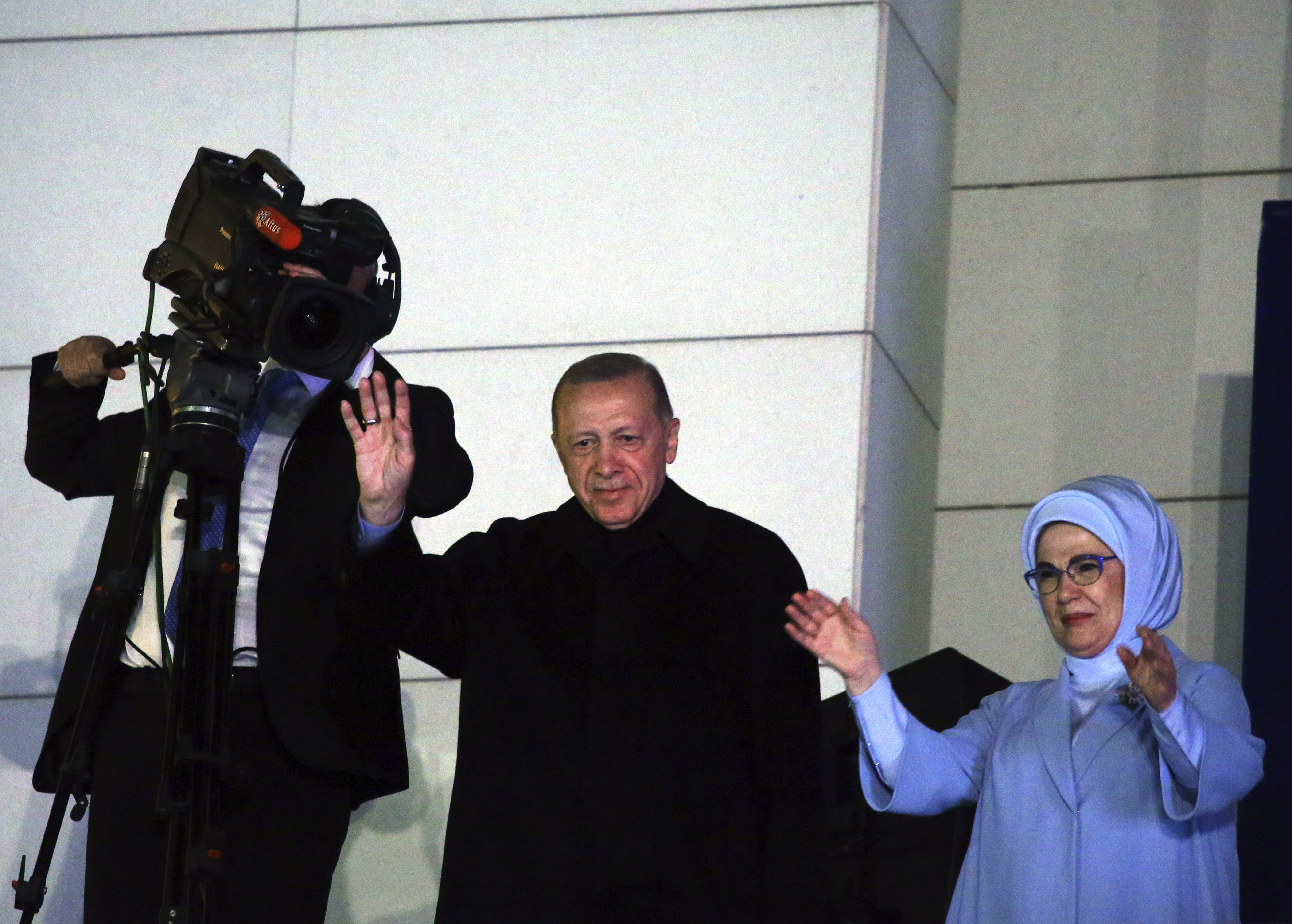 Turkish President Recep Tayyip Erdogan, center, and his wife, Emine, acknowledge supporters at the party headquarters, in Ankara, Turkey, early Monday, May 15, 2023. Erdogan, who has ruled his country with an increasingly firm grip for 20 years, was locked in a tight election race Sunday, with a make-or-break runoff against his chief challenger possible as the final votes were counted. (AP Photo/Ali Unal)Associated Press/LaPresseOnly Italy and Spain