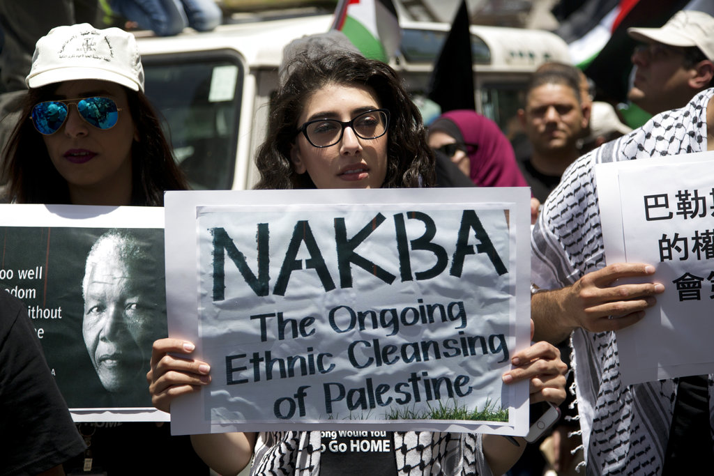 Palestinians take part in a rally to mark the 69th anniversary of 'Nakba Day', in the West Bank city of Ramallah, Monday, May 15, 2017. Nakba Day, or the Day of the Catastrophe, marks the first Israeli-Arab war in 1948 when hundreds of thousands of Palestinians fled, or were expelled from their homes. (AP Photo/Majdi Mohammed)