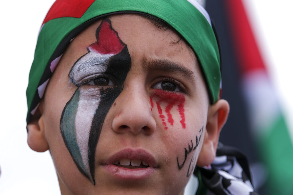 A demonstrator takes part in a protest outside the Federal Building against Israel and in support of Palestinians, and marking the 73rd anniversary of what the Palestinians call the 