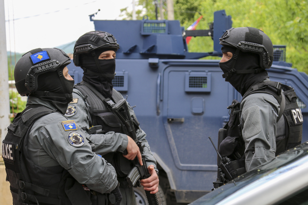 Kosovo police officers guard a municipal building after yesterday's violent clashes between police and ethnic Serbs, in the town of Zvecan, northern Kosovo, Saturday, May 27, 2023. Serbia on Saturday condemned NATO-led peacekeepers stationed in neighboring Kosovo for their alleged failure to stop 