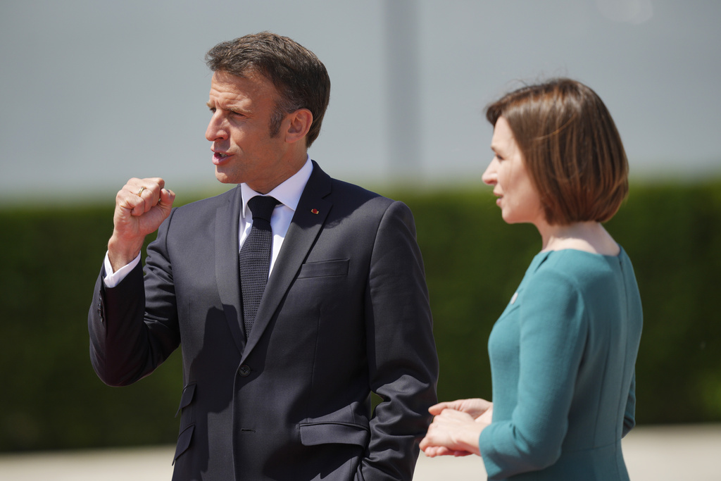 Moldova's President Maia Sandu, right, greets France's President Emmanuel Macron during arrivals for the European Political Community Summit at the Mimi Castle in Bulboaca, Moldova, Thursday, June 1, 2023. Leaders are meeting in Moldova Thursday for a summit aiming to show a united front in the face of Russia's war in Ukraine and underscore support for the Eastern European country's ambitions to draw closer to the West and keep Moscow at bay. (AP Photo/Vadim Ghirda)
