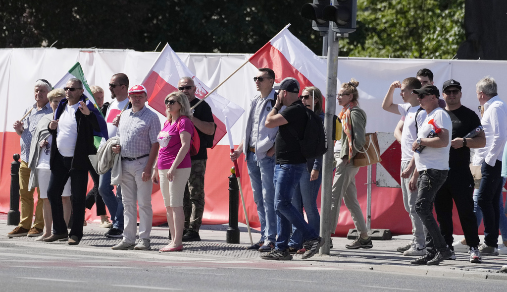Participants join an anti-government march led by the centrist opposition party leader Donald Tusk, who along with other critics accuses the government of eroding democracy, in Warsaw, Poland, on June 4, 2023. The march is being held on the 34th anniversary of the first democratic elections in 1989 after Poland emerged from decades of communist rule. (AP Photo/Czarek Sokolowski)