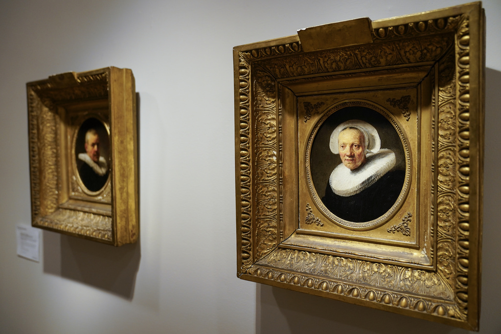 Exceptionally rare paintings by the great Dutch master Rembrandt hang at Christie's auction house, Tuesday, June 13, 2023, in New York. The two oil portraits dated on 1635 depict members of the Rembrandt's family and were last on display in 1824. The estimated auction value range is expected to be between five and $10 million. (AP Photo/John Minchillo)