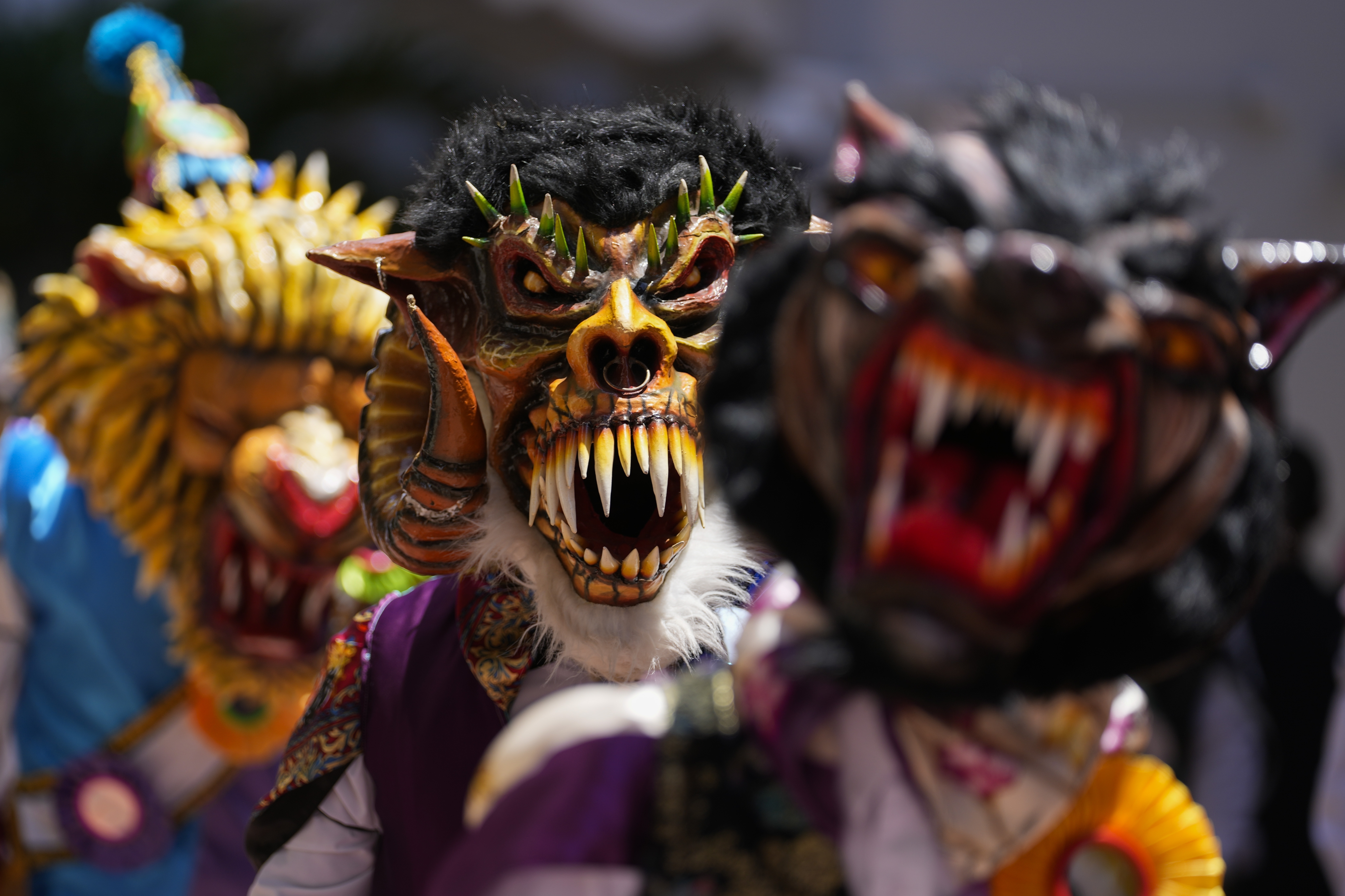 Dancers wearing devil masks perform during a Corpus Christi procession near the Santa Maria La Antigua basilica in Panama City, Sunday, June 18, 2023. Corpus Christi is a religious festival that celebrates the body and blood of Christ. (AP Photo/Arnulfo Franco)