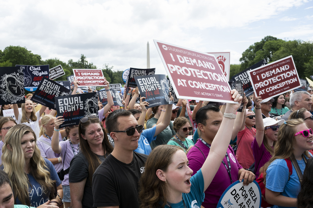 FILE - Anti-abortion activists cheer before Republican presidential candidate former Vice President Mike Pence speaks at the National Celebrate Life Rally at the Lincoln Memorial on Saturday, June 24, 2023, in Washington. (AP Photo/Kevin Wolf, File)