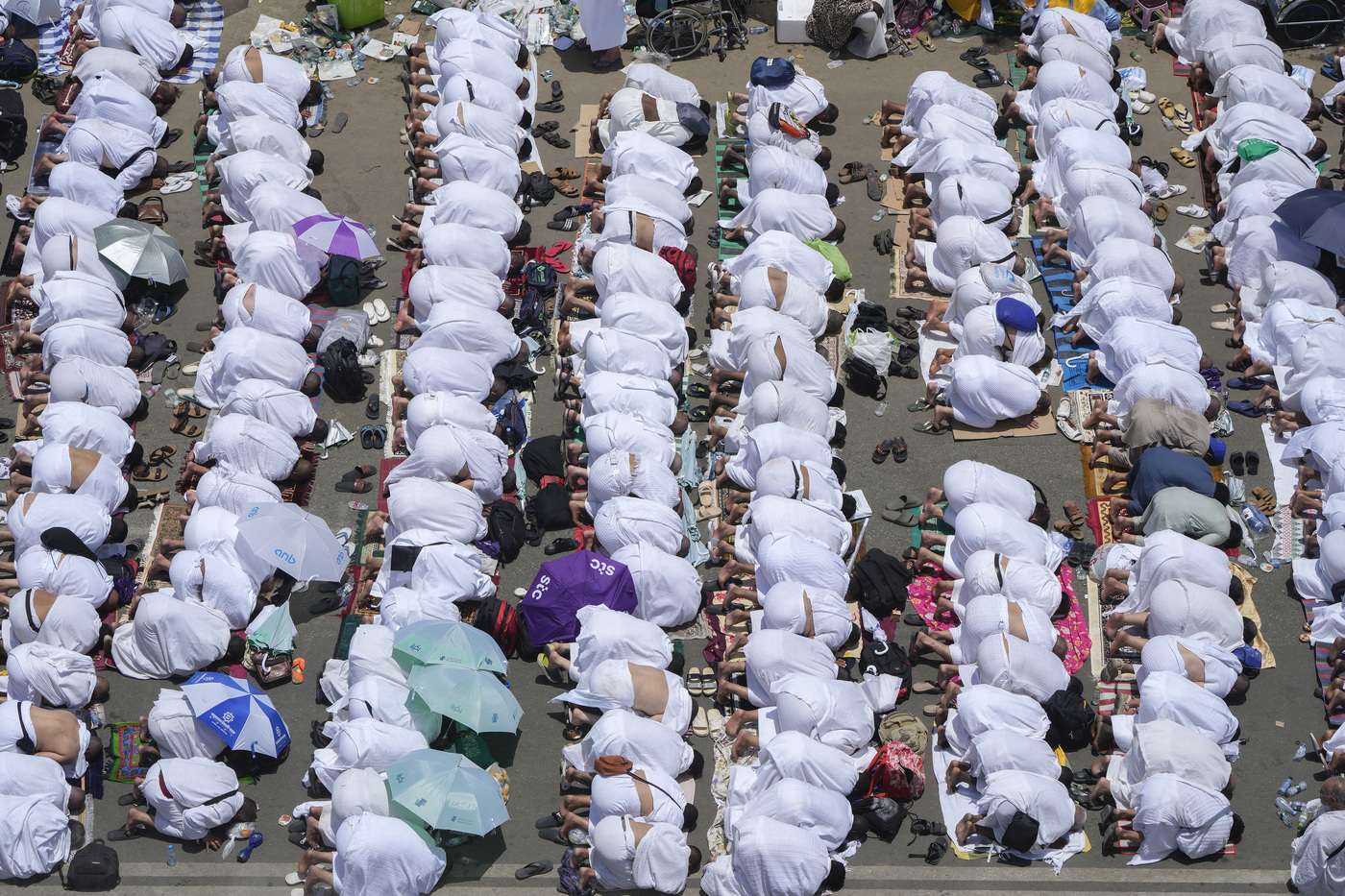 Muslim pilgrims pray outside Namira Mosque in Arafat, on the second day of the annual Hajj pilgrimage, near the holy city of Mecca, Saudi Arabia, Tuesday, June 27, 2023. Around two million pilgrims are converging on Saudi Arabia's holy city of Mecca for the largest Hajj since the coronavirus pandemic severely curtailed access to one of Islam's five pillars. (AP Photo/Amr Nabil)
