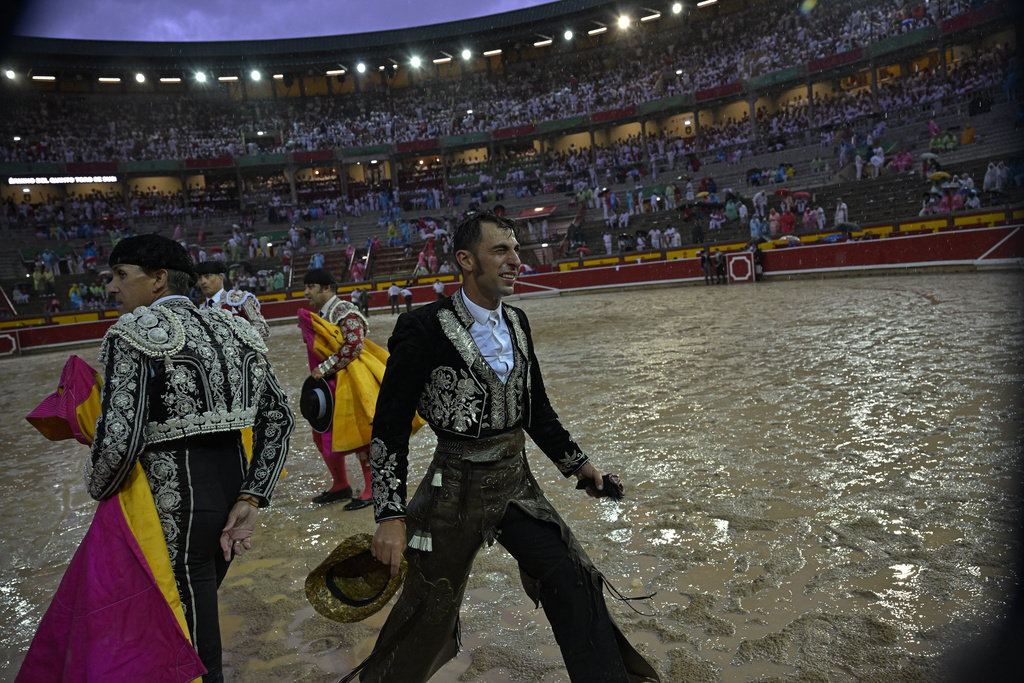 Roberto Armendartiz, a Spanish ''rejoneador'' or mounted bullfighter, performs during a horseback bullfight as the rain falls at San Fermin Fiestas in Pamplona, northern Spain, Thursday, July 6, 2023. Of all traditions surrounding the varied world of bullfighting, the horse mounted 
