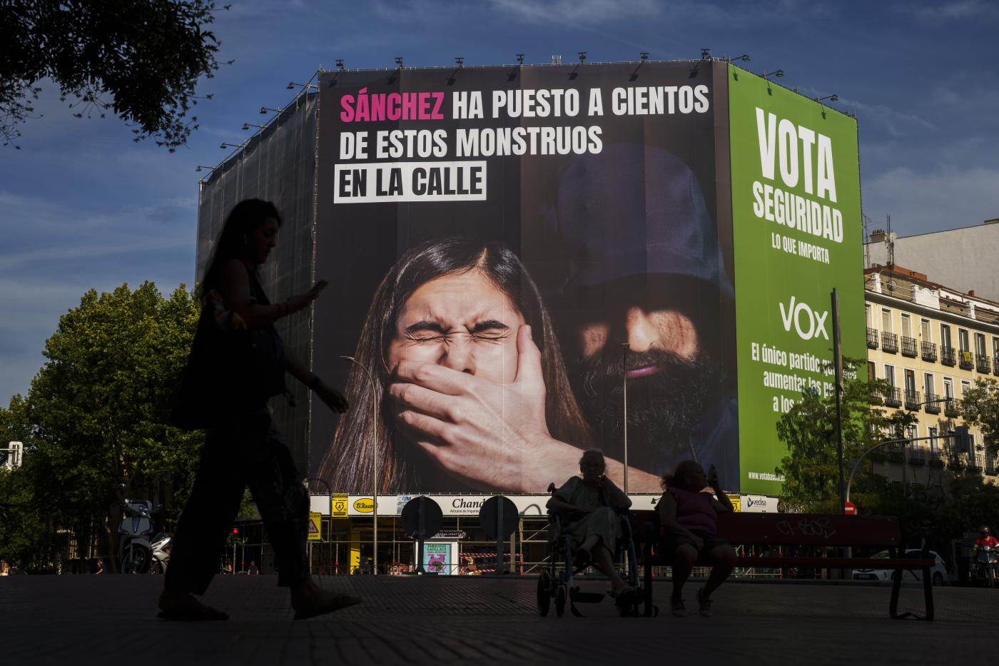 A woman walks past a giant electoral poster from VOX far-right party reading in Spanish: "Sanchez has put hundreds of these monsters on the street. Vote security. What matters.", is displayed on a building in Madrid, Spain, Wednesday, July 12, 2023. A general election on Sunday July 23, 2023, could make Spain the latest European Union member to swing to the right. Prime Minister Pedro Sánchez called the early election after his Spanish Socialist Workers' Party and its far-left partner, Unidas Podemos, took a beating in local and regional elections. (AP Photo/Manu Fernandez)

Associated Press/LaPresse
Only Italy and Spain