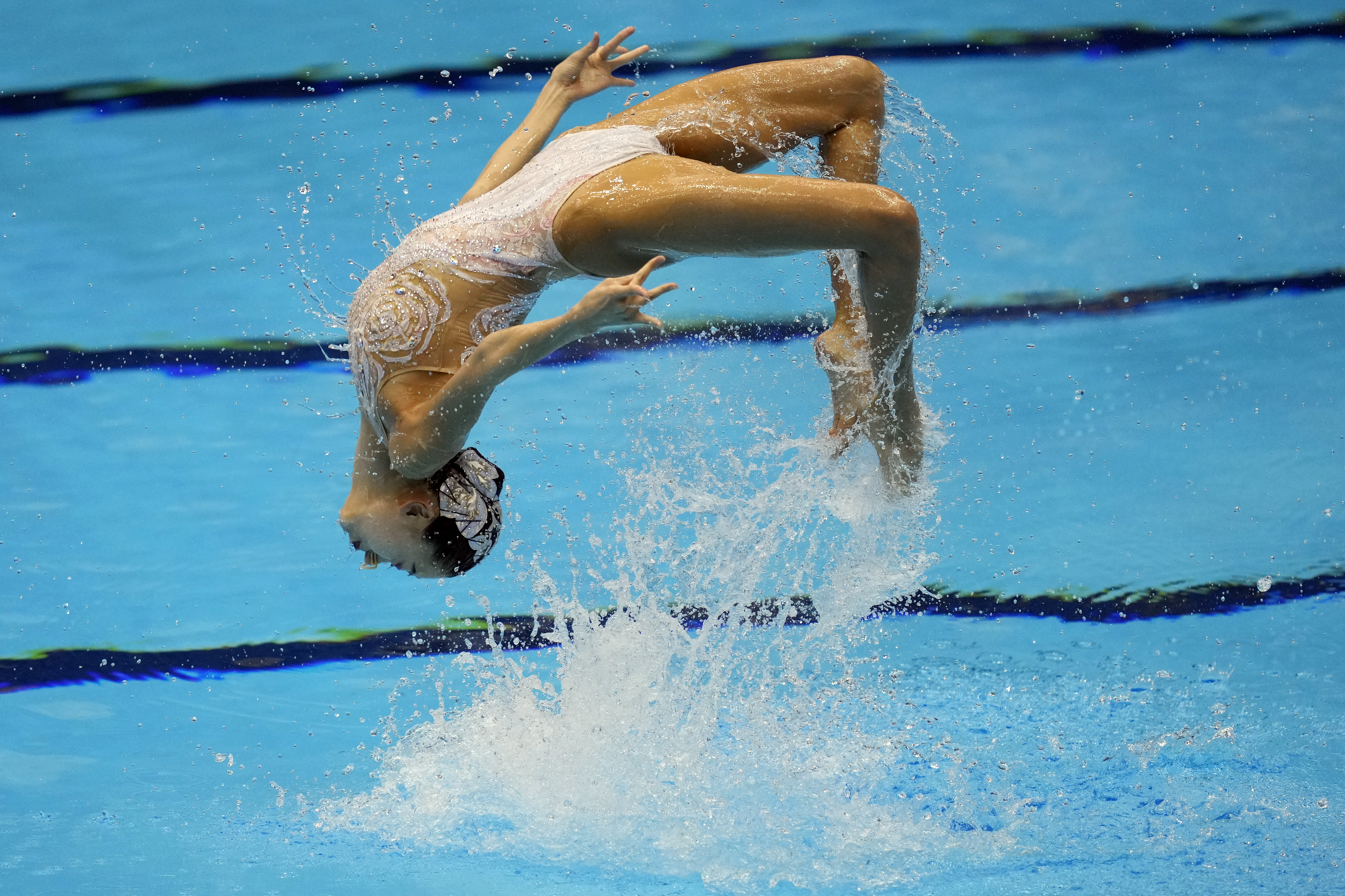 China's Cheng Wentao with Shi Haoyu, under water, compete during the mixed duet free preliminary of the artistic swimming at the World Swimming Championships in Fukuoka, Japan,Friday, July 21, 2023. (AP Photo/Eugene Hoshiko)