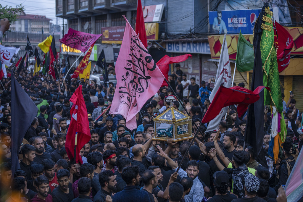 Kashmiri Shiite Muslims participate in a Muharram procession in Srinagar, Indian controlled Kashmir, Thursday, July 27, 2023. Muharram is a month of mourning for Shiite Muslims in remembrance of the martyrdom of Imam Hussein, the grandson of the Prophet Muhammad. (AP Photo/Dar Yasin)
