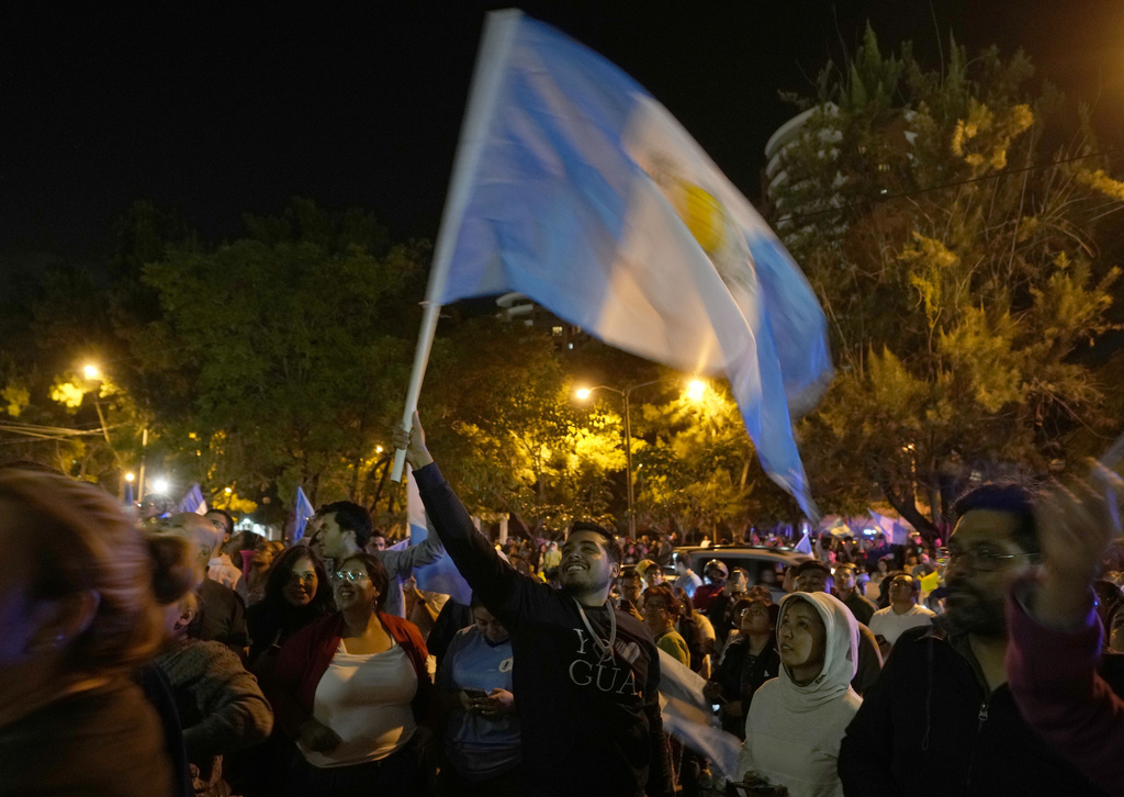 Supporters of presidential candidate Bernardo Arevalo celebrate after preliminary results showed him the victor in a presidential run-off election, in Guatemala City, Sunday, Aug. 20, 2023. (AP Photo/Moises Castillo)