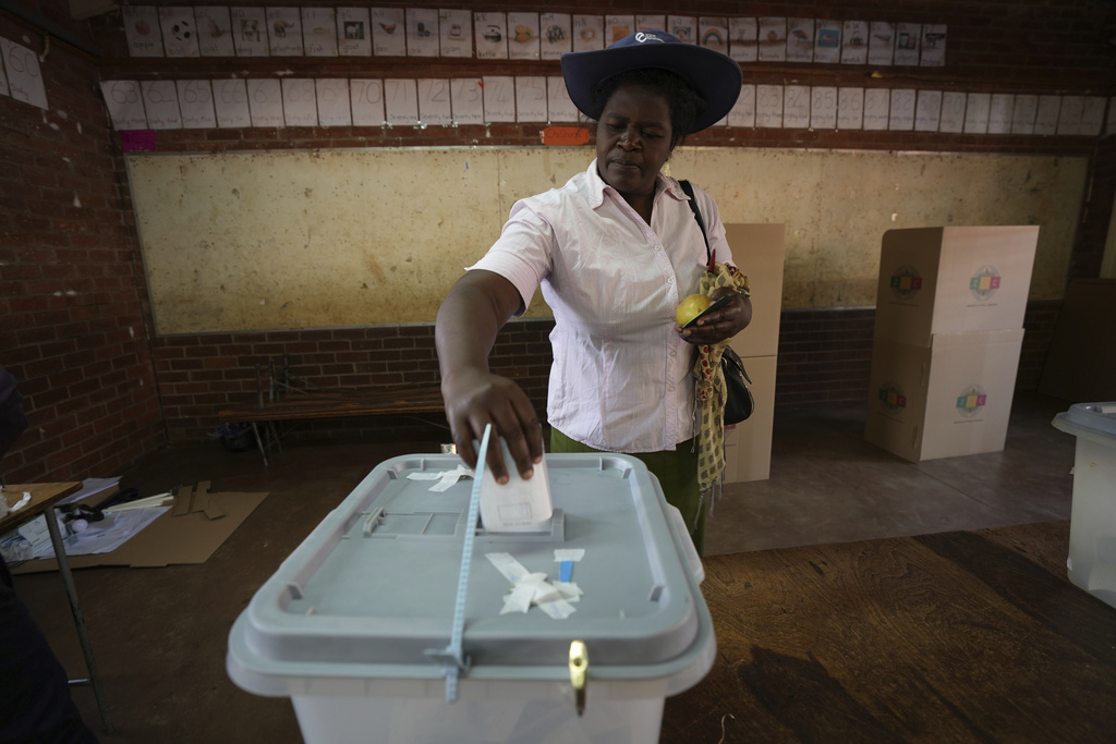 A woman casts her vote at a polling station in Harare, Wednesday, Aug. 23 2023. Polls opened in Zimbabwe on Wednesday as President Emmerson Mnangagwa seeks a second and final term in a country with a history of violent and disputed votes. (AP Photo/Tsvangirayi Mukwazhi)