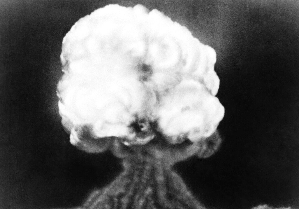 FILE - This is the mushroom cloud of the first atomic explosion at Trinity Test Site, New Mexico, July 16, 1945. By ending 77 years of almost uninterrupted peace in Europe, war in Ukraine war has joined the dawn of the nuclear age and the birth of manned spaceflight as a watershed in history. After nearly a half-year of fighting, tens of thousands of dead and wounded on both sides, massive disruptions to supplies of energy, food and financial stability, the world is no longer as it was. (AP Photo)