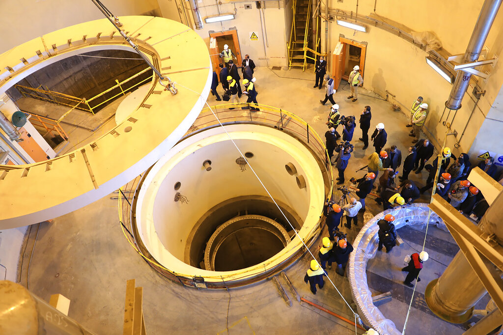 FILE - In this photo released by the Atomic Energy Organization of Iran, technicians work at the Arak heavy water reactor's secondary circuit, as officials and media visit the site, near Arak, 150 miles (250 kilometers) southwest of the capital Tehran, Iran, Dec. 23, 2019. Iranian officials now speak openly about something long denied by Tehran as it enriches uranium at its closest-ever levels to weapons-grade material: Iran is ready to build an atomic weapon at will. This could be put to the test Thursday, Aug. 4, 2022, as Iran, the U.S. and the European Union prepare for a snap summit that appears to be a last-ditch effort in Vienna to revive Tehran’s tattered nuclear deal. (Atomic Energy Organization of Iran via AP, File)
