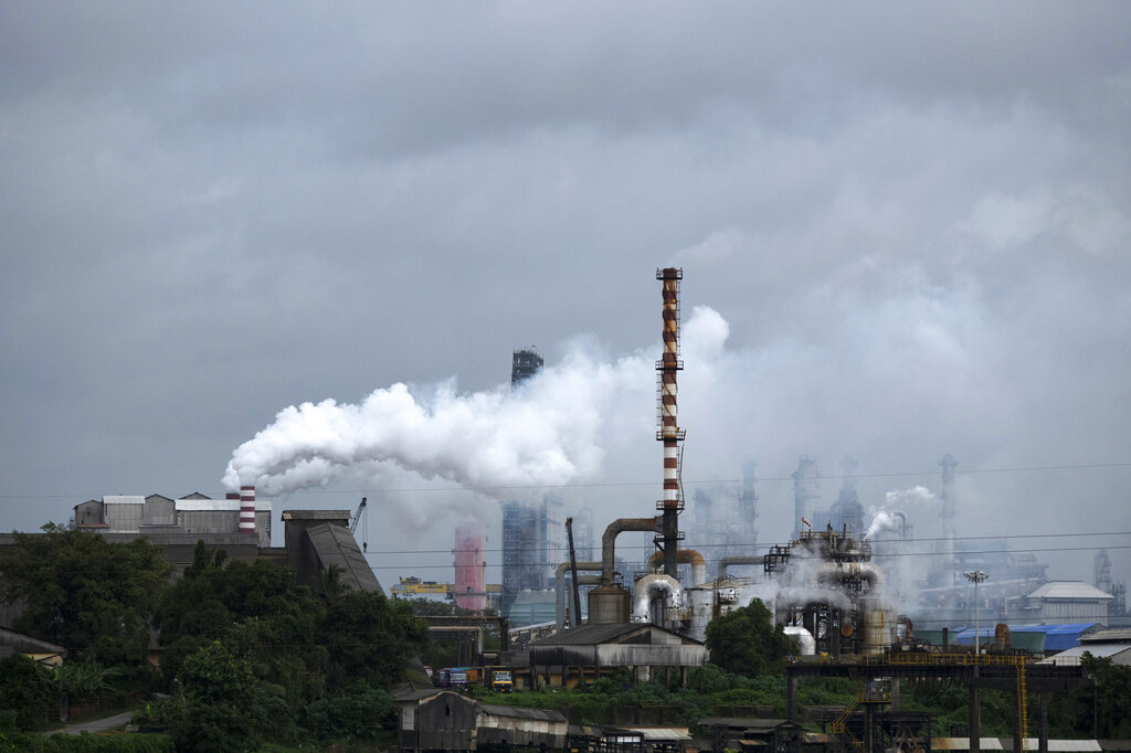 FILE - Steam emits from a crude oil refinery in Kochi, Kerala state, India, on Aug. 26, 2022. A new accounting of carbon dioxide emissions finds that heat-trapping gas pollution from fossil fuels went up about 1% more than last year. Researchers say efforts to remove carbon dioxide from the atmosphere aren't being scaled up fast enough and can’t be relied on to meet crucial climate goals. A report published Thursday by scientists in Europe and the United States found that new methods of CO2 removal currently account for only 0.1% of the 2 billion metric tons sucked from the atmosphere each year. (AP Photo/R S Iyer, File)
