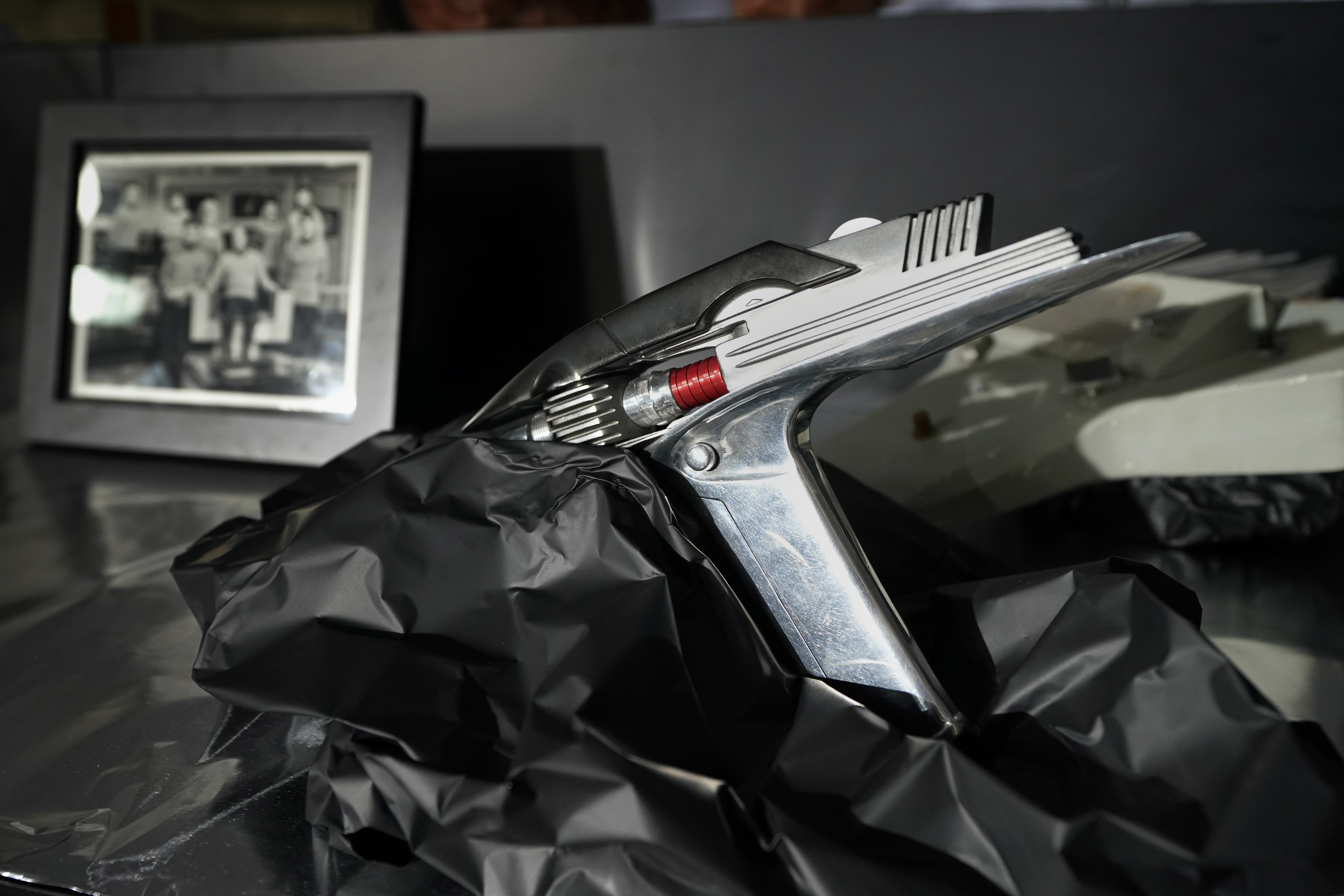 A prop called the Phaser Pistol, that was used in the 1960's televsion series Star Trek, sits on display at Heritage Auctions, Thursday, Aug. 30, 2023, in Irving, Texas. While Greg Jein's work over nearly half a century making miniature models in Hollywood included such iconic creations as the alien mothership in 