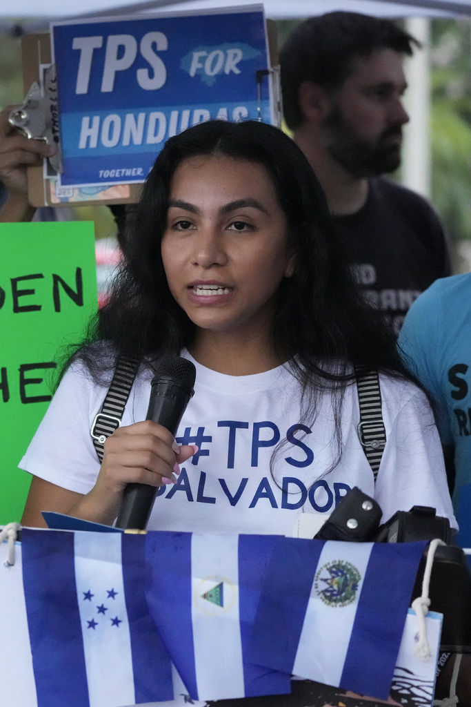 Idalia Quinteros, 23, speaks, during a news conference calling for a new designation of Temporary Protected Status (TPS) for migrants from Nicaragua, El Salvador, and Honduras, in front of the Immigration and Customs Enforcement (ICE) offices, Wednesday, July 26, 2023, in Miramar, Fla. Quinteros came from El Salvador at age 8, to be reunited with her parents, but came too late to qualify for Deferred Action for Childhood Arrival (DACA) status. (AP Photo/Wilfredo Lee)