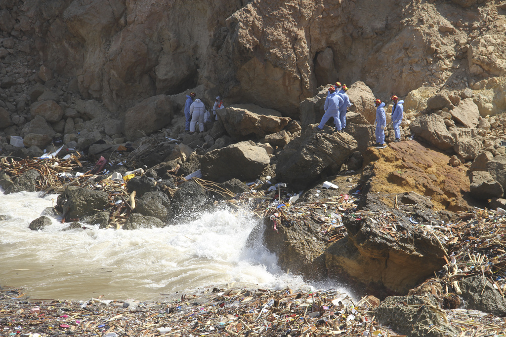 Rescue teams look for flash flood victims in the city of Derna, Libya, Monday, Sept. 18, 2023. Mediterranean storm Daniel caused flooding that overwhelmed two dams, sending a wall of water through the city. More than 10,000 were killed, and another 10,000 are missing. (AP Photo/Yousef Murad)