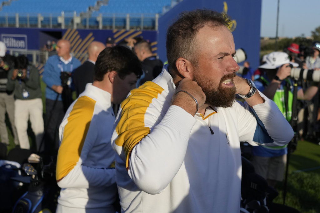 Europe's Shane Lowry adjusts his fleece as he takes part in the Europe photo call at the Marco Simone Golf Club in Guidonia Montecelio, Italy, Tuesday, Sept. 26, 2023. The Ryder Cup starts Sept. 29, at the Marco Simone Golf Club. (AP Photo/Andrew Medichini)