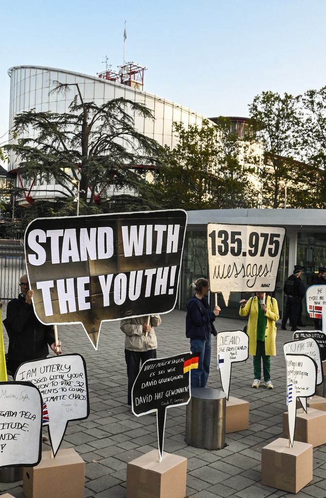 IMAGE DISTRIBUTED FOR AVAAZ -  Members of the global civic movement Avaaz gather in front of the European Court of Human Rights with messages of support from around the world for the 6 applicants in the 