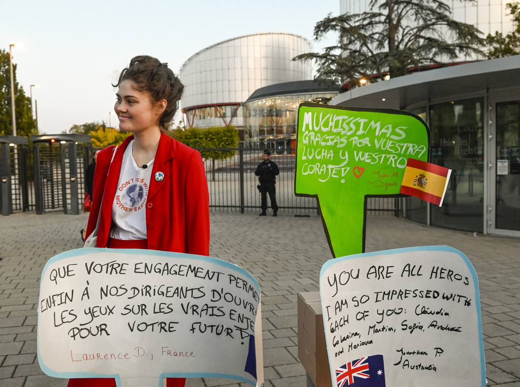 IMAGE DISTRIBUTED FOR AVAAZ - Legal co-coordinator of Auroramålet Ida Edling stands in front of the European Court of Human Rights with messages of support from around the world for the 6 applicants in the 