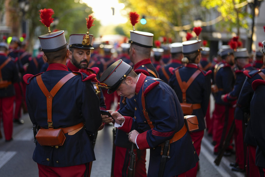 Royal Guard members gather before the military parade on the national holiday known as 