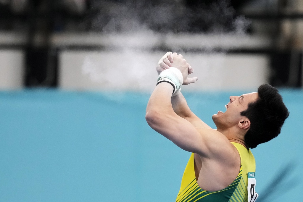 Brazil's Artur Mariano celebrates after winning gold in the men's gymnastics horizontal bar exercise at the Pan American Games in Santiago, Chile, Wednesday, Oct. 25, 2023. (AP Photo/Martin Mejia)
