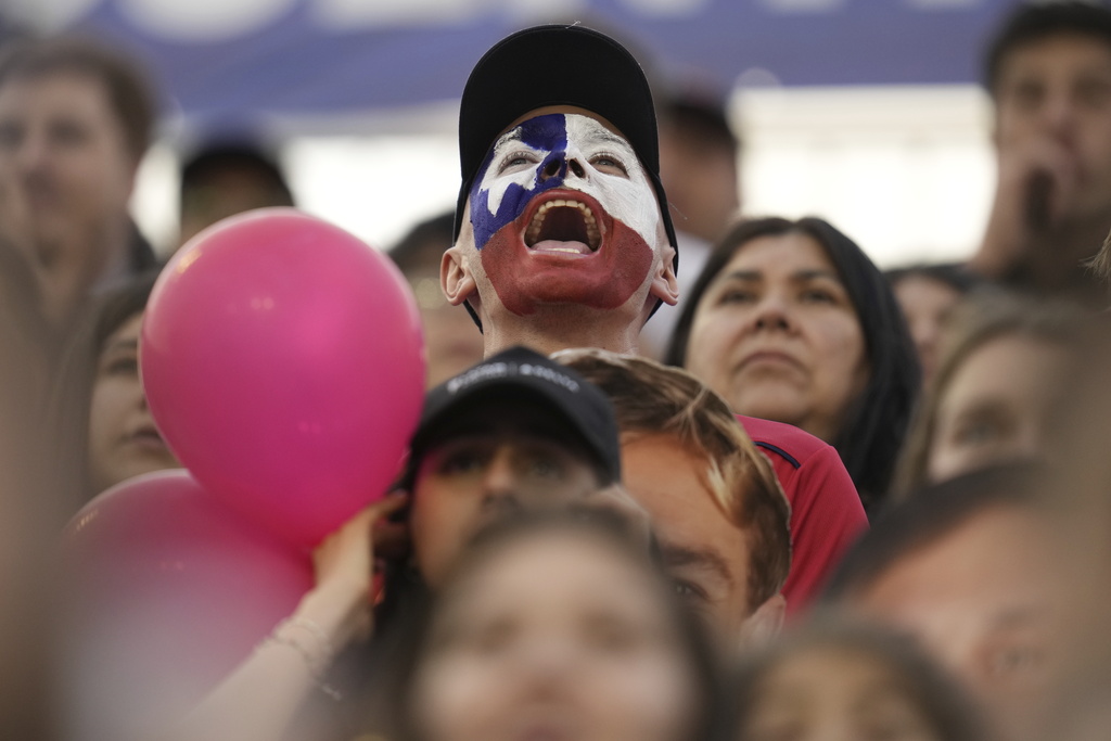 A fan watches the men's field hockey match between Chile and Peru during the Pan American Games in Santiago, Chile, Wednesday, Oct. 25, 2023. (AP Photo/Matias Delacroix)