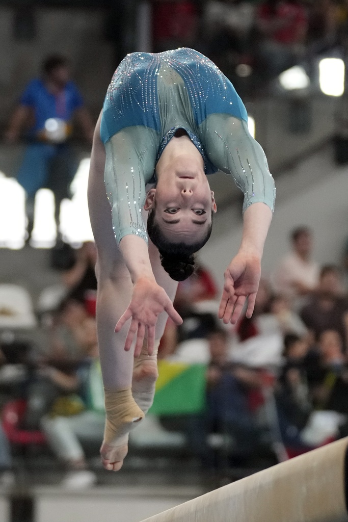 Canada's Ava Stewart competes in the women's gymnastics balance beam exercise final at the Pan American Games in Santiago, Chile, Wednesday, Oct. 25, 2023. (AP Photo/Martin Mejia)