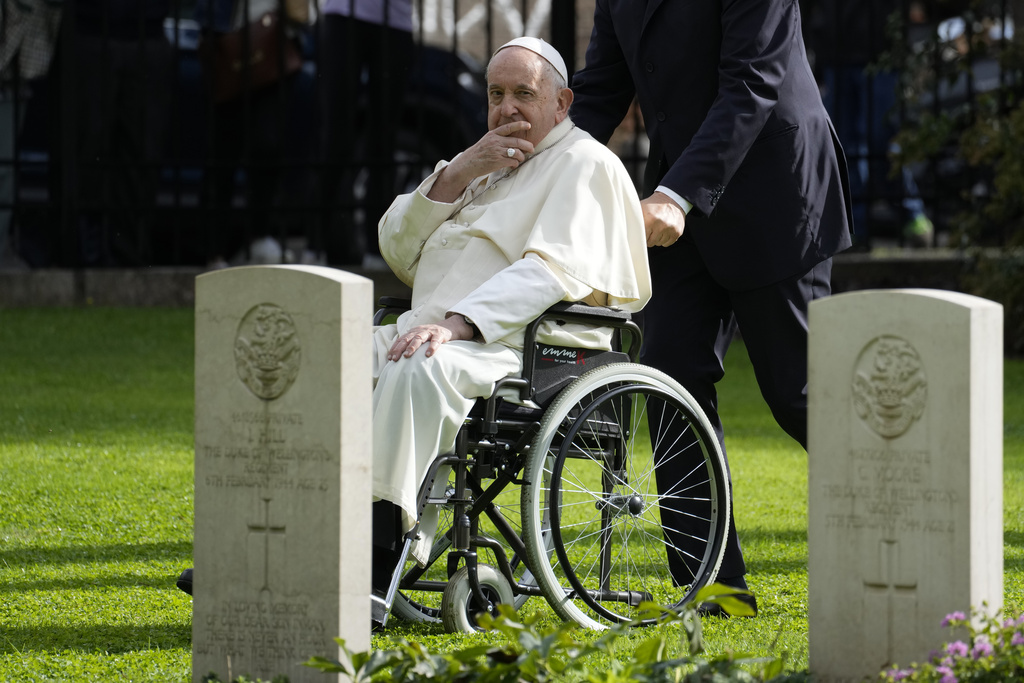 Pope Francis leaves after saying mass for dead people at Rome's Commonwealth cemetery with the graves of 426 war dead from WW II, Thursday, Nov. 2, 2023. The Mass comes on Italy's Nov. 2 holiday to honor the dead. (AP Photo/Andrew Medichini)