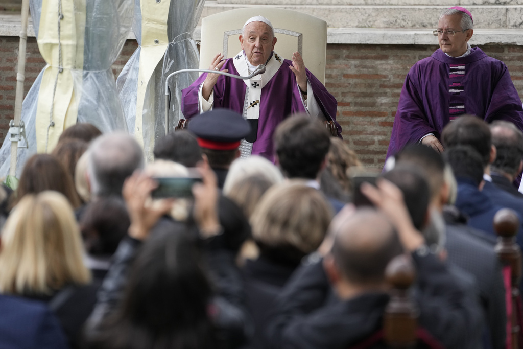 Pope Francis says mass for dead people at Rome's Commonwealth cemetery with the graves of 426 war dead from WW II, Thursday, Nov. 2, 2023. The Mass comes on Italy's Nov. 2 holiday to honor the dead. (AP Photo/Andrew Medichini)