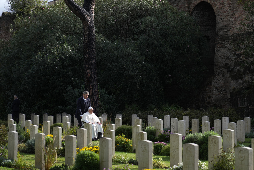 Pope Francis arrives to hold mass for dead people at Rome's Commonwealth cemetery with the graves of 426 war dead from WW II, Thursday, Nov. 2, 2023. The Mass comes on Italy's Nov. 2 holiday to honor the dead. (AP Photo/Andrew Medichini)