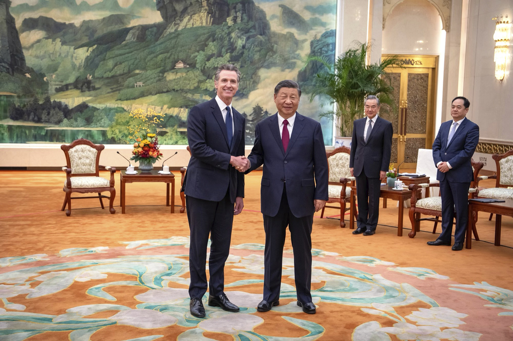 FILE - In this photo released by Office of the Governor of California, California Gov. Gavin Newsom, left, meets with Chinese President Xi Jinping at the Great Hall of the People in Beijing, on Oct. 25, 2023. (Office of the Governor of California via AP, File)