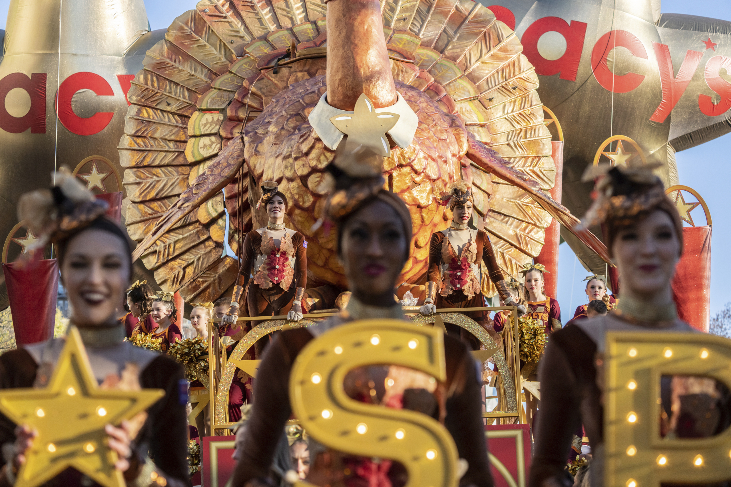 Parade performers lead the Tom Turkey float down Central Park West at the start of the Macy's Thanksgiving Day parade, Thursday, Nov. 23, 2023, in New York. (AP Photo/Jeenah Moon)