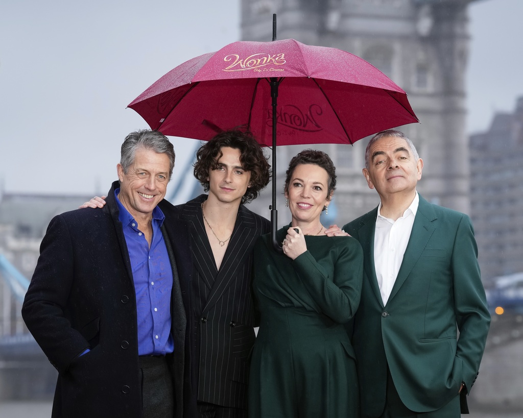 Hugh Grant, from left, Timothee Chalamet, Olivia Colman and Rowan Atkinson pose for photographers upon arrival at the photo call of the film 'Wonka' in London, Monday, Nov. 27, 2023. (Photo by Scott Garfitt/Invision/AP)