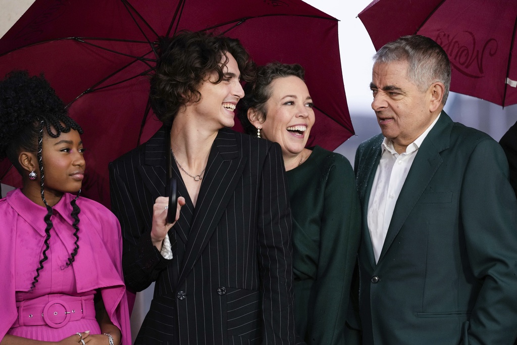 Calah Lane, from left, Timothee Chalamet, Olivia Colman and Rowan Atkinson pose for photographers upon arrival at the photo call of the film 'Wonka' in London, Monday, Nov. 27, 2023. (Photo by Scott Garfitt/Invision/AP)
