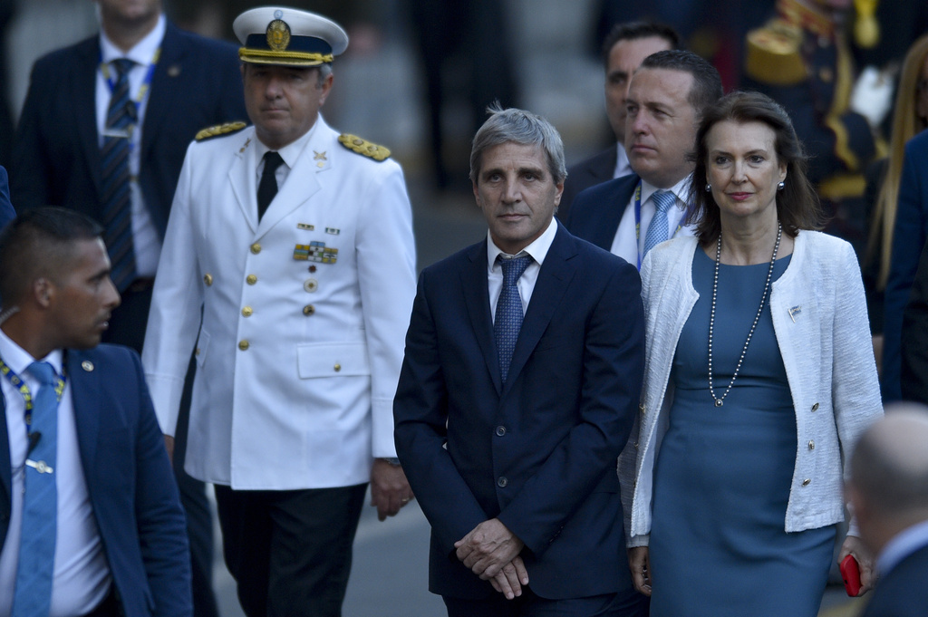 Argentina's newly sworn-in Foreign Affairs minister Diana Mondino, right, and Economy minister Luis Caputo arrive at the Metropolitan Cathedral for an interfaith ceremony in Buenos Aires, Argentina, Sunday, Dec. 10, 2023. (AP Photo/Gustavo Garello)