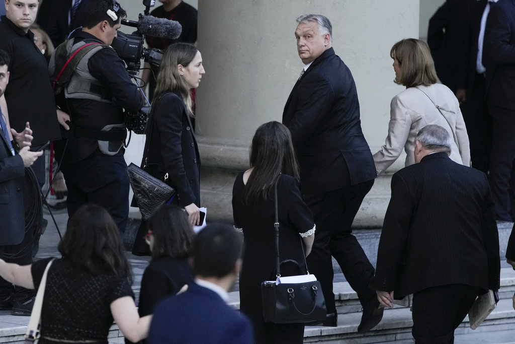 Hungarian Prime Minister Viktor Orban, right, arrives at the Metropolitan Cathedral for an interfaith ceremony with Argentina's newly sworn-in President Javier Milei in Buenos Aires, Argentina, Sunday, Dec. 10, 2023. (AP Photo/Mario De Fina)