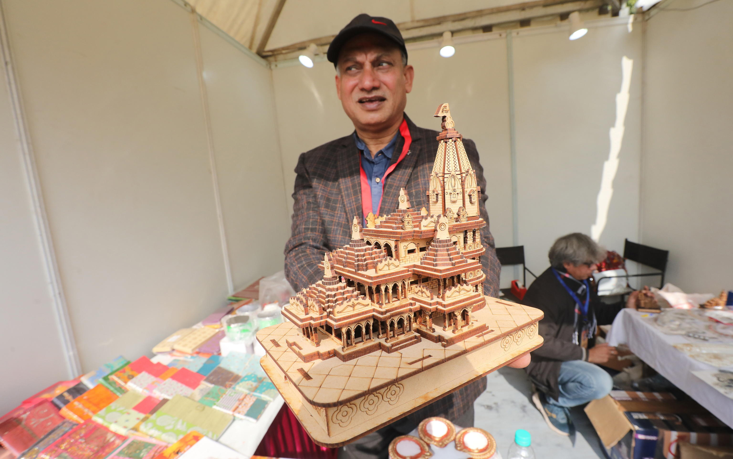 epa11087201 An Indian man holds a model replica of Ayodhya Ram Mandir at the India International Ramayana Festival in New Delhi, India, 18 January 2024. Indian Council of Cultural Relations (ICCR) organized a five-day long festival emphasizing the enduring relevance and universality of the Ramayana ahead of the Pran Pratistha ceremony, or the inauguration ceremony of the Lord Ram temple in Ayodhya, that is scheduled for 22 January 2024. Pran Pratistha is the act which transforms an idol into a deity, giving it the capacity to accept prayers. The Indian prime minister will perform the Pran Pratishtha ceremony on the inauguration day.  EPA/HARISH TYAGI
