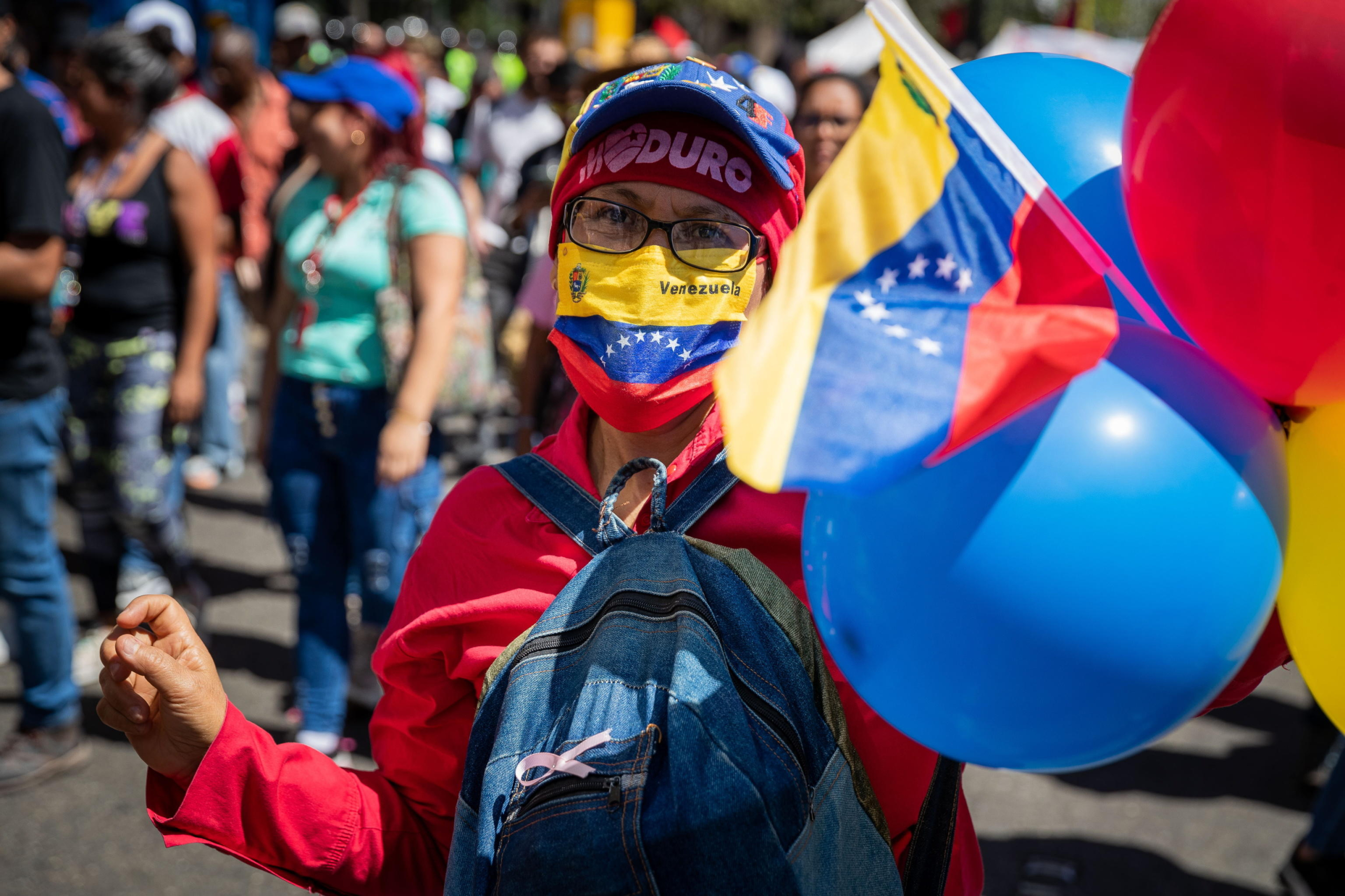 epa11099831 A woman participates in a march in support of the government of President Nicolas Maduro in Caracas, Venezuela, 23 January 2024. Maduro assured that he will continue to govern the country 