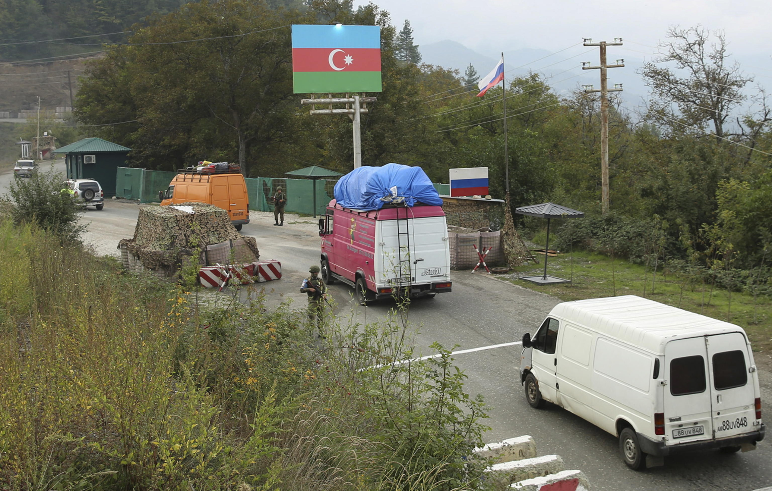 epa10883970 Ethnic Armenian flee Karabakh for Armenia at the Lachin checkpoint controlled by Russian peackeepers and Azeri border guards, Azerbaijan, 26 September 2023. Azerbaijan on 19 September 2023 launched a brief military offensive on the contested region of Nagorno-Karabakh, a breakaway enclave that is home to some 120,000 ethnic Armenians. Following a ceasefire agreed on 20 September 2023, Azerbaijan opened all checkpoints with Armenia for the unimpeded exit of civilians from the disputed territory. The Armenian government announced the evacuation of more than 19,000 local residents from Nagorno-Karabakh, and a humanitarian center has been set up in the village of Kornidzor near the so-called Lachin corridor, the main route between Armenia and the breakaway region. Russian peacekeepers escorted convoys with civilians leaving Nagorno-Karabakh for Armenia, the Russian defense ministry said.  EPA/ROMAN ISMAYILOV