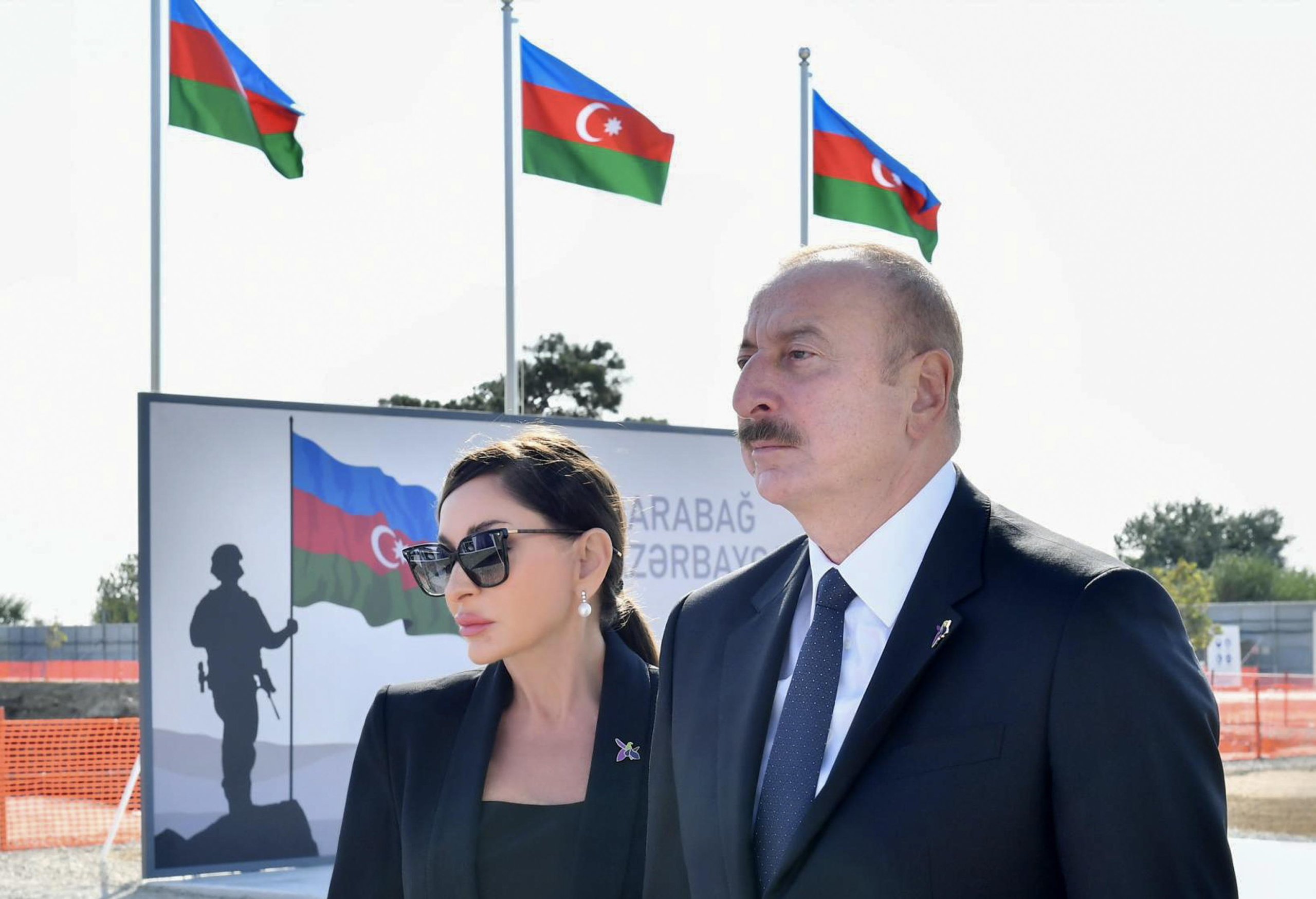 epa10885437 A handout photo made available by Azerbaijan President Press Service shows Azerbaijan's President Ilham Aliyev (R) and First Lady of Azerbaijan, Mehriban Aliyeva attending a flower-laying ceremony at the memorial stone in Victory Park, which is under construction, during Remembrance Day celebrations, in Baku, Azerbaijan, 27 September 2023. Azerbaijan pays tribute to the heroes of the 44-day Karabakh war in 2020, which began on 27 September, with an Azerbaijani offensive that reclaimed regions around the disputed former Nagorno-Karabakh Autonomous Region, the former Hadrut region and the city of Shusha.  EPA/AZERBAIJAN PRESIDENT PRESS SERVICE / HANDOUT  HANDOUT EDITORIAL USE ONLY/NO SALES