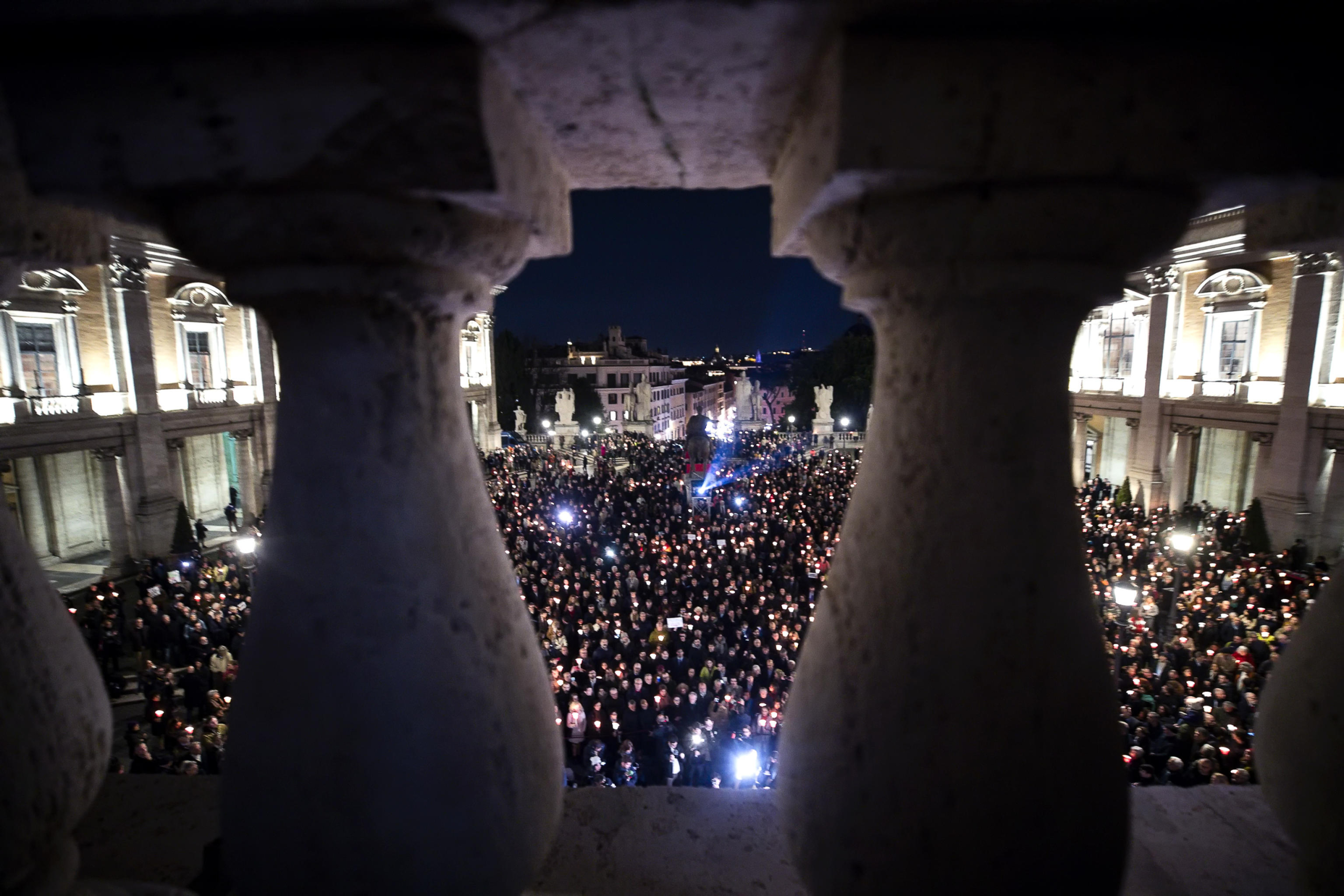 Demonstrators during the torchlight procession in memory of Russian opposition leader and outspoken Kremlin critic Alexei Navalny, who died in a Arctic penal colony, the Federal Penitentiary Service of the Yamalo-Nenets Autonomous District, in Capitol Square, Rome, Italy, 19 February 2024. ANSA/ANGELO CARCONI