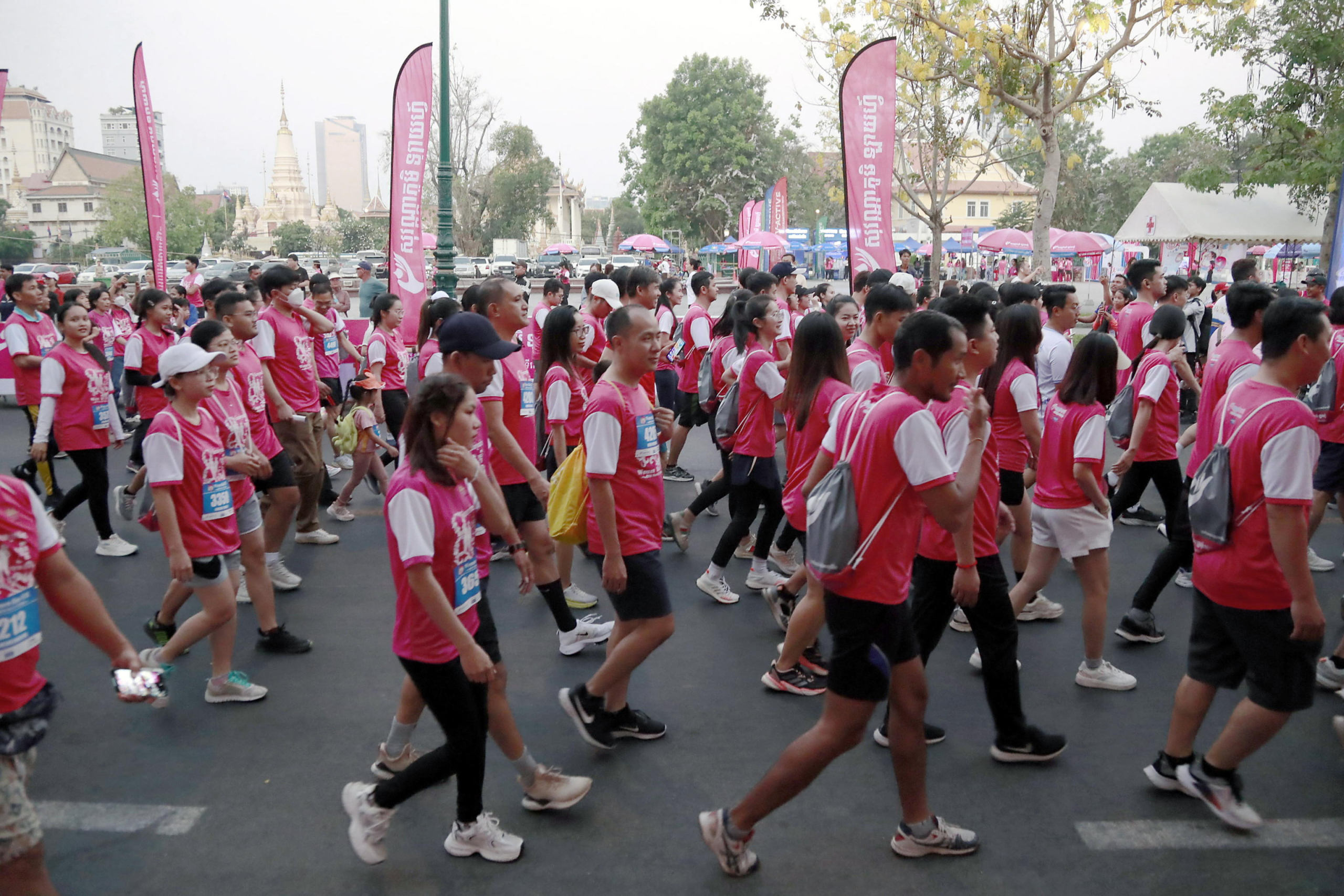 epa11205858 Participants in action during 'Women Run 10k', an event held to mark International Women's Day, in Phnom Penh, Cambodia, 08 March 2024.  EPA/KITH SEREY