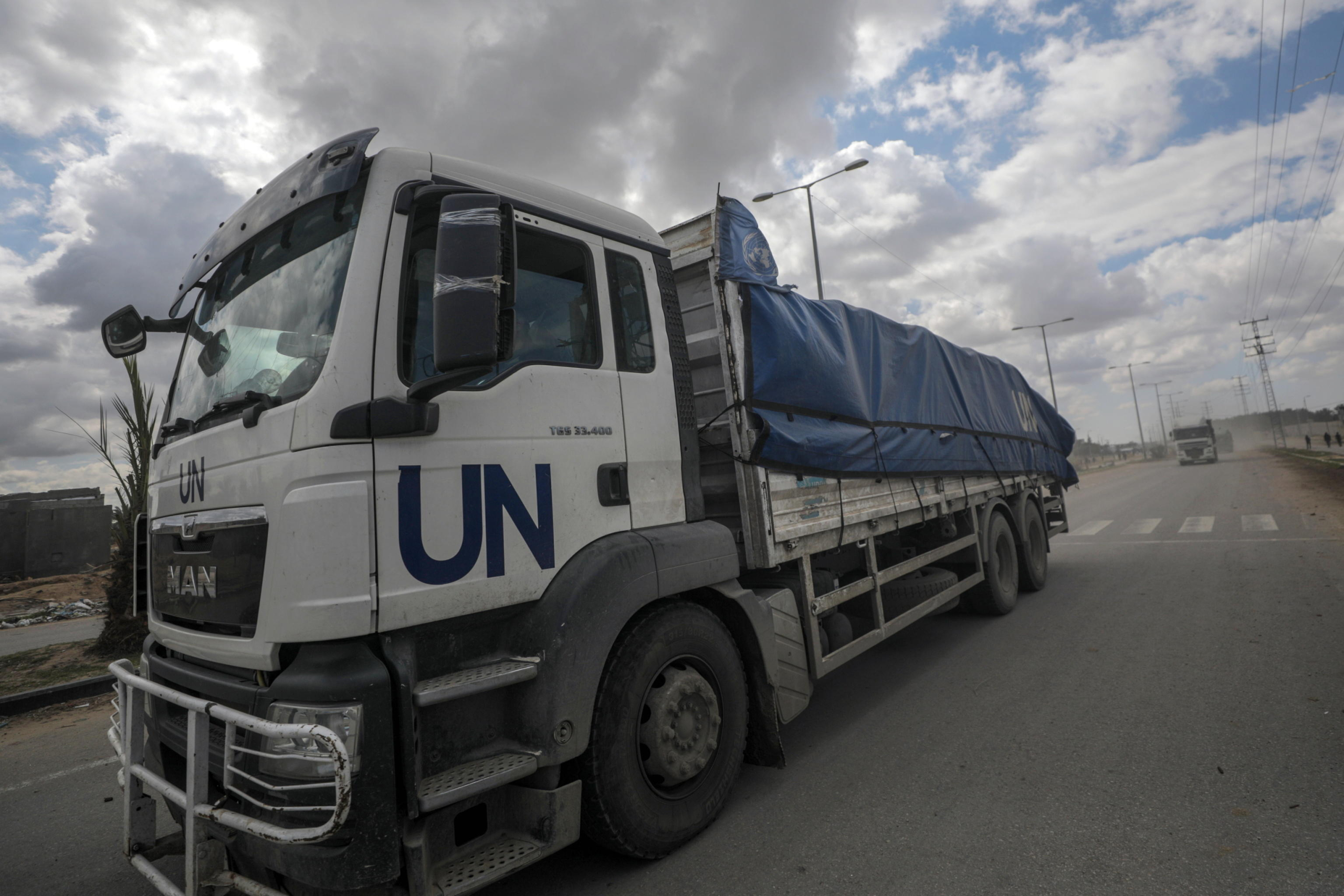 epa11207281 Trucks carrying aid to Gaza residents cross from Rafah border to Deir Al Balah town, southern Gaza Strip, 08 March 2024. Since 07 October 2023, up to 1.9 million people, or more than 85 percent of the population, have been displaced throughout the Gaza Strip, some more than once, according to the United Nations Relief and Works Agency for Palestine Refugees in the Near East (UNRWA), which added that most civilians in Gaza are in 'desperate need of humanitarian assistance and protection'. The international community is combining efforts to increase humanitarian assistance to the residents of Gaza affected by the ongoing conflict.  EPA/MOHAMMED SABER