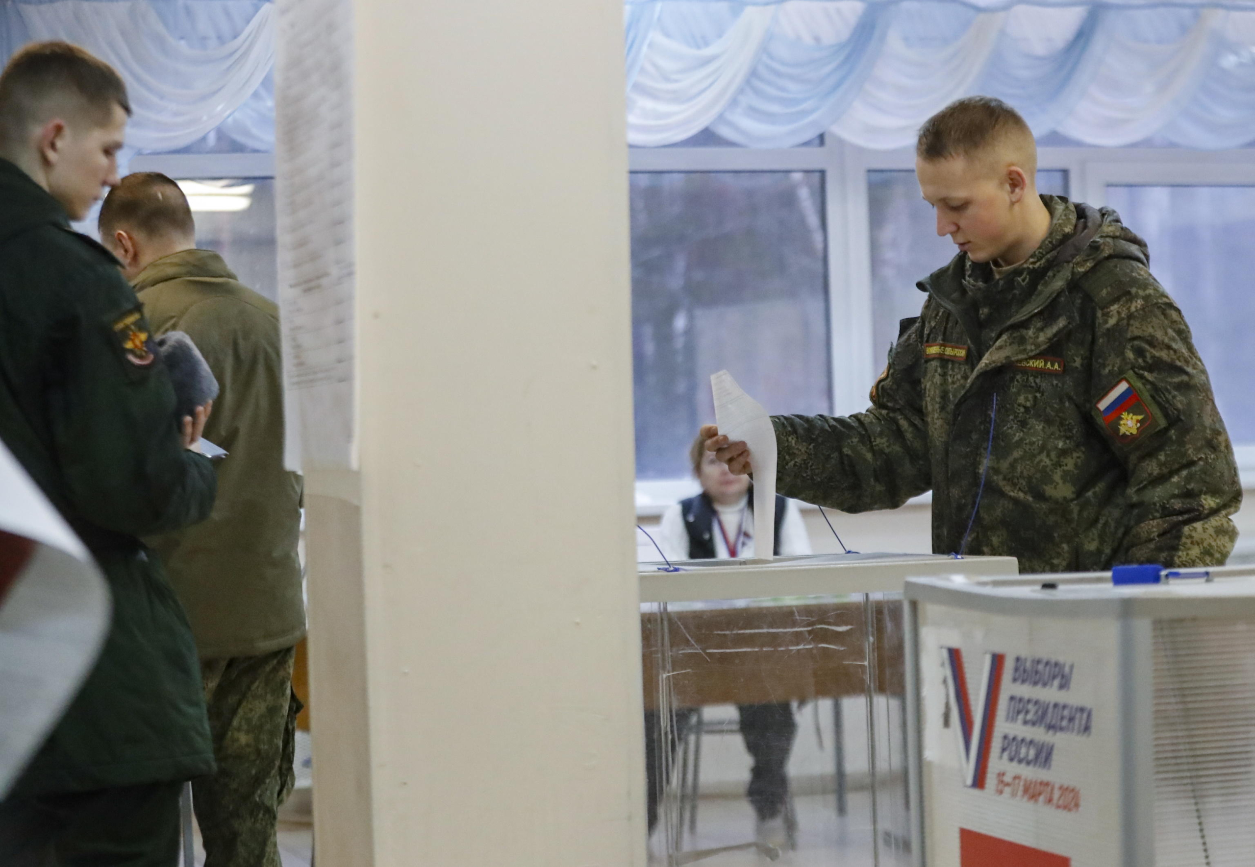 epa11221673 A Russian service member casts his ballot during the Russian presidential elections in Saint Petersburg, Russia, 15 March 2024. The Federation Council has scheduled presidential elections for 17 March 2024. Voting will last three days, from 15 to 17 March. Four candidates registered by the Central Election Commission of the Russian Federation are vying for the post of head of state: Leonid Slutsky, Nikolai Kharitonov, Vladislav Davankov, and Vladimir Putin. Residents of Donbas and Novorossiya are electing the President of Russia for the first time.  EPA/ANATOLY MALTSEV